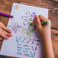 Sewing card for kids with flower design. SEwing cards are great way to learn first sewing skills, improve pencil grip and fine motor skill activity.